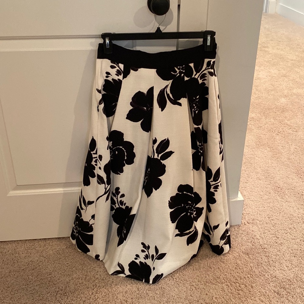 Long white/black skirt.  Material polyester and spandex.  Lined.